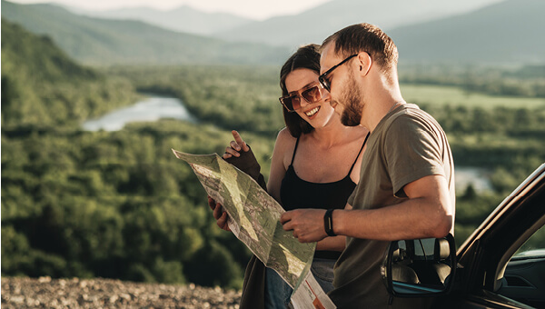 Couple looking at map for roadtrip